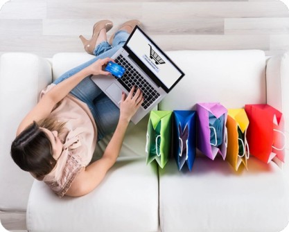 A woman shopping through her laptop